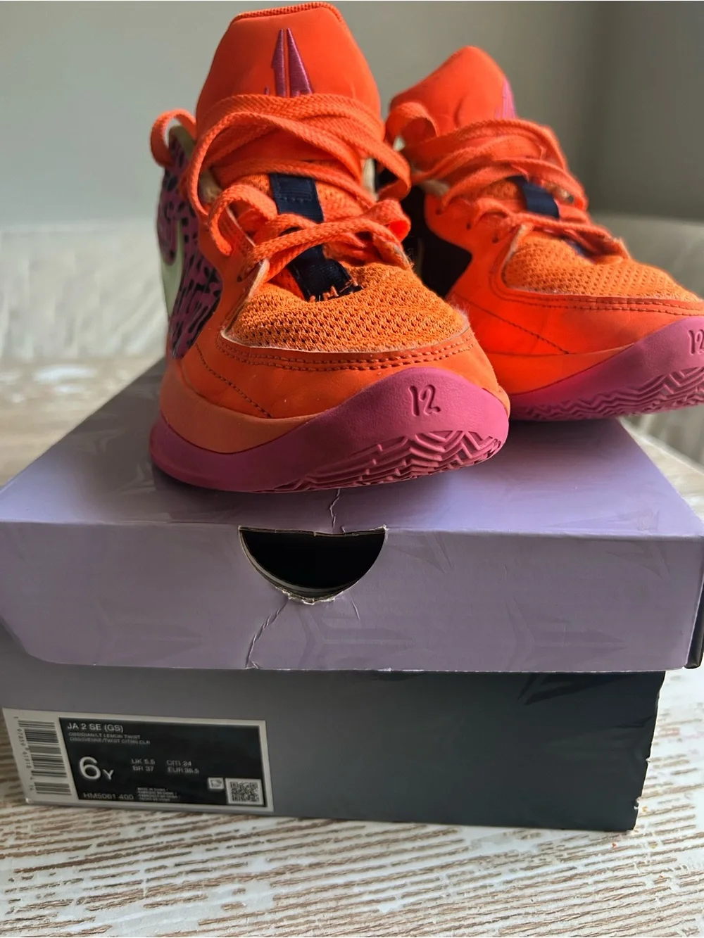 Nike Kids Low-Top Sneakers in Orange with Pink and Black Accents